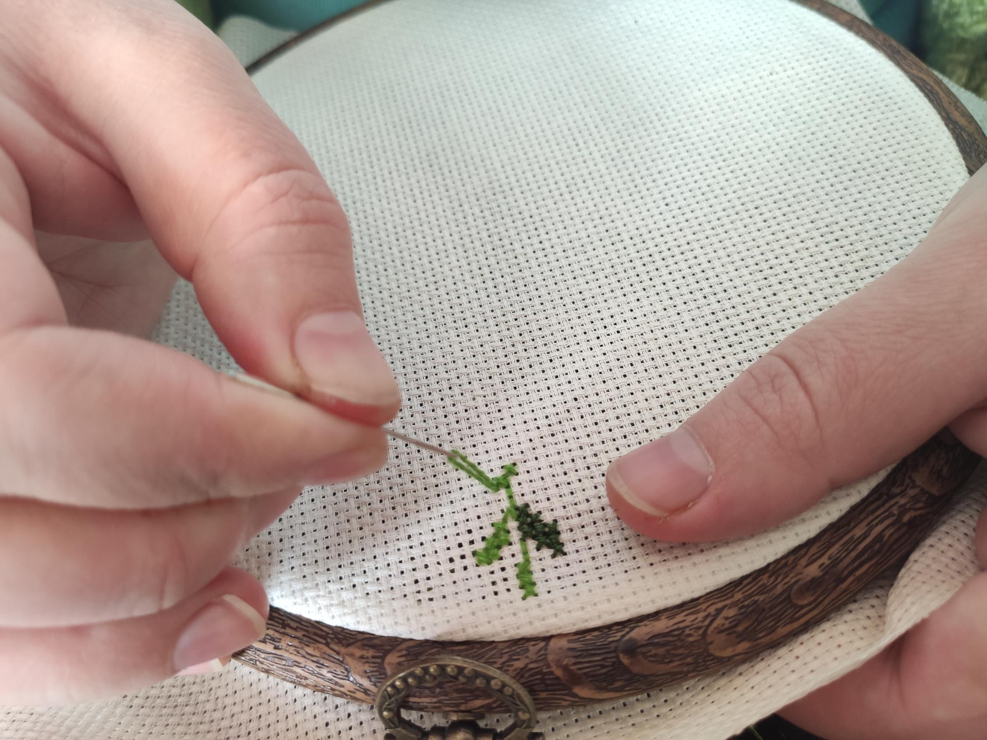 Close-up of hand embroidery on linen